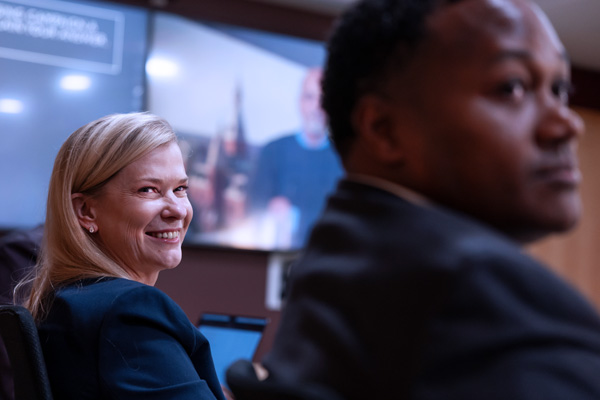 Two students in Cornell’s EMBA Americas boardroom.